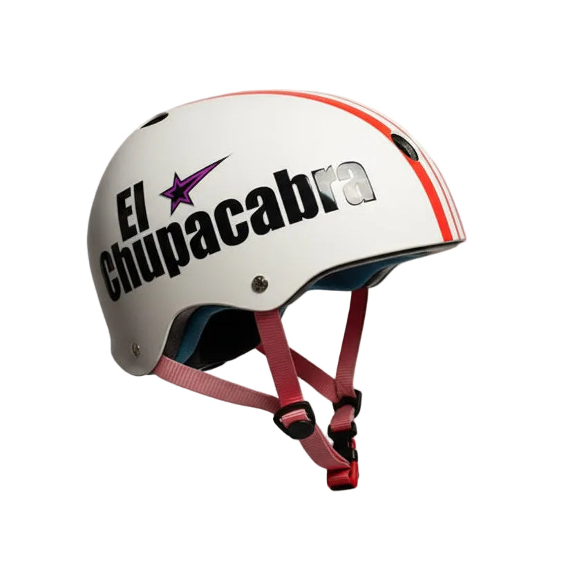 Child wearing a white helmet with 'El Chupacabra' text and star logo in a room.